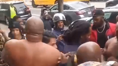 Mike Tyson brawls in the street with Shannon Briggs to the astonished gaze of fans