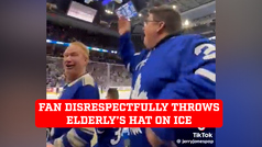 Fan disrespectfully throws an elderly person's hat on the ice during hockey game