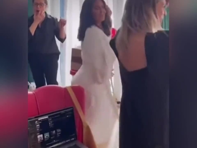 Salma Hayek teases fans with exposed breasts while dancing in a