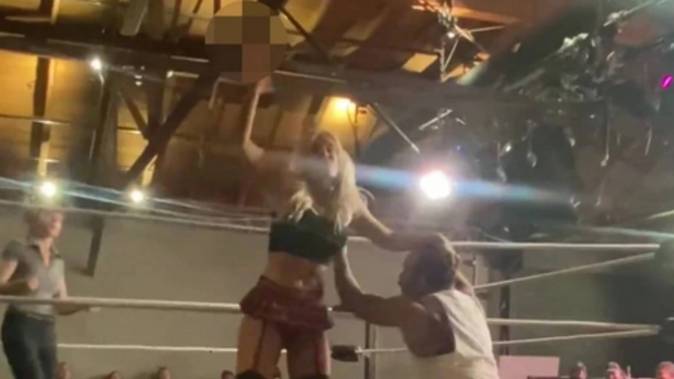 WWE star Scarlett Bordeaux attacks and beats her rival with a sex toy