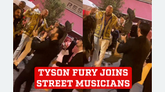 Tyson Fury joins street musicians for a joyful dance to 'Volare'