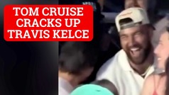 Travis Kelce and Tom Cruise laugh together at Taylor Swift concert
