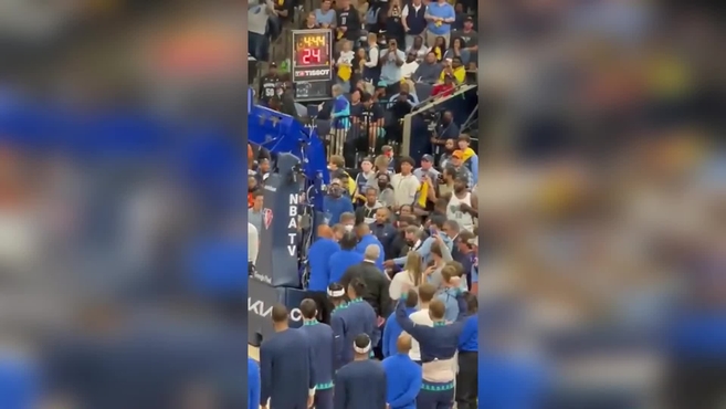 Woman interrupts Grizzlies-Timberwolves by chaining herself to basket stanchion