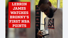 LeBron James proudly watches son Bronny's first points in the NBA