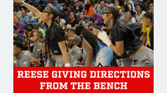 Angel Reese from the bench cheering on the Chicago Sky