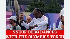 Snoop Dogg carries, walks and dances with Olympic torch