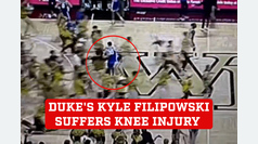 Duke's Kyle Filipowski suffers knee injury after colliding with fan as crowd erupts on court