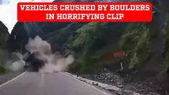 GRAPHIC CONTENT: Horrifying clip shows two vehicles getting crushed by massive boulders