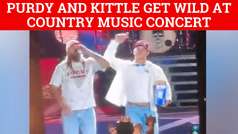 Brock Purdy and George Kittle slam beers on stage at country music show