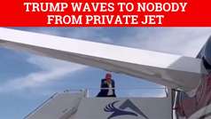 Donald Trump waves at fake nonexistent crowd from private jet