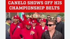 Canelo Alvarez flaunts his championship belts upon arrival at weigh-in for fight against Berlanga