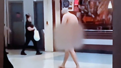 Man casually strolls around Dallas airport completely naked
