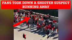 Kansas City Chiefs fans tackle a shooting suspect during Super Bowl Rally